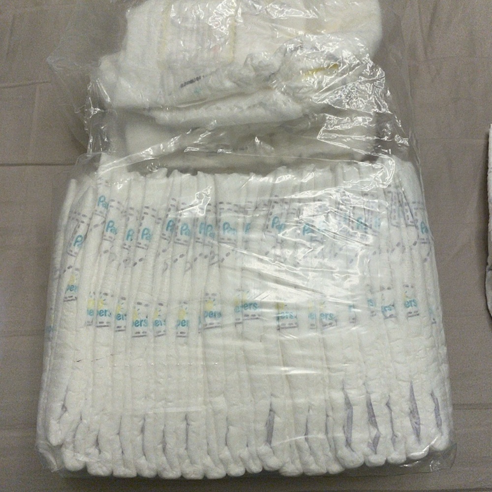 24 Newborn Pampers Diapers (no longer needed size)